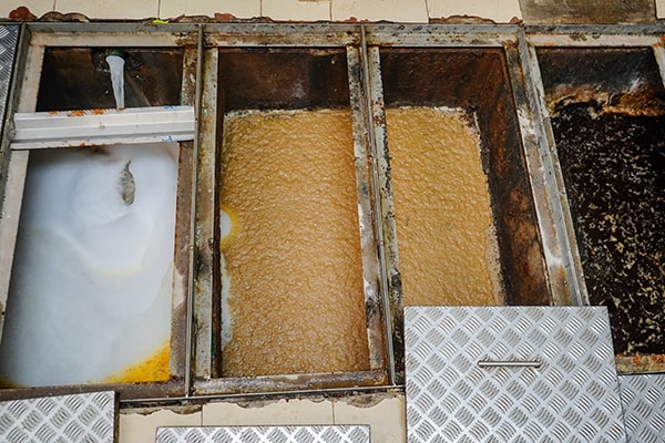 regular grease trap maintenance can help save money by preventing expensive plumbing issues and avoiding fines for non-compliance with regulations